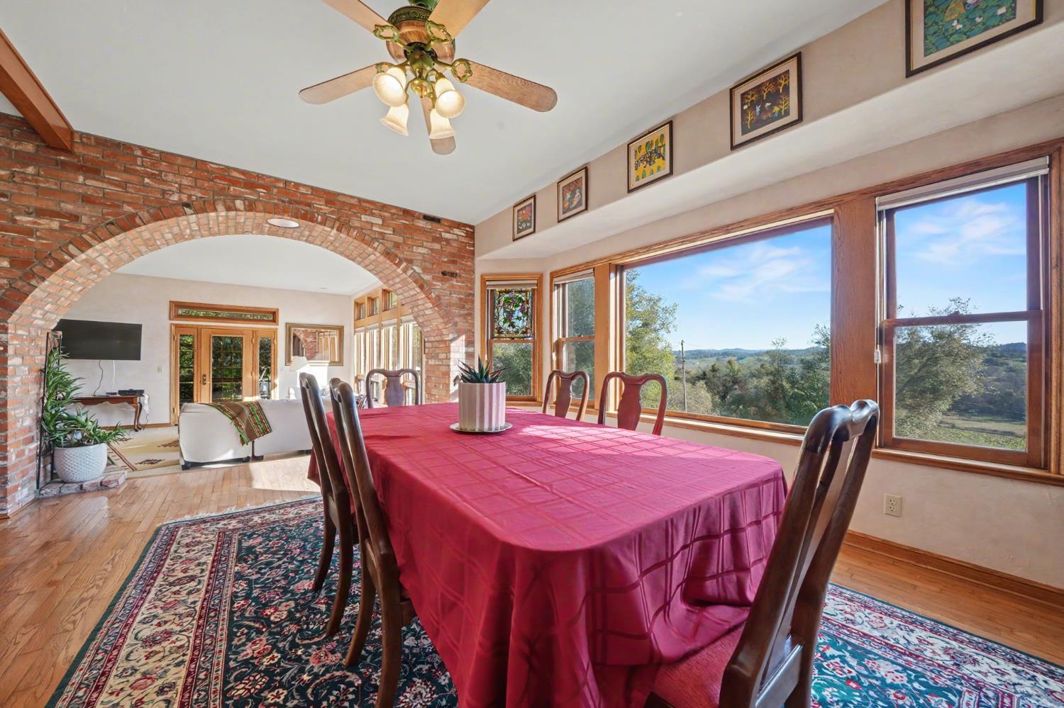 22707 Upton Road Plymouth, CA 95669 - Photo 34 of 99 a view of a dining room with furniture window and wooden floor