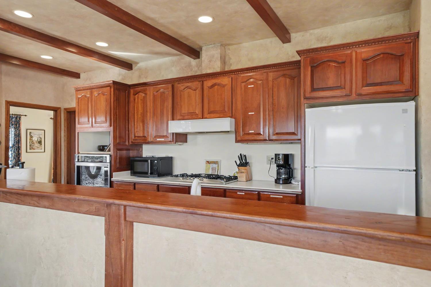 22707 Upton Road Plymouth, CA 95669 - Photo 38 of 99 a kitchen with stainless steel appliances granite countertop a refrigerator sink and cabinets