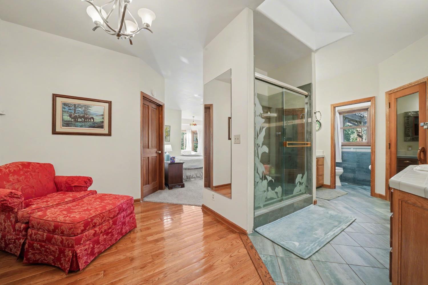 22707 Upton Road Plymouth, CA 95669 - Photo 46 of 99 a spacious bedroom with a bed and a shower