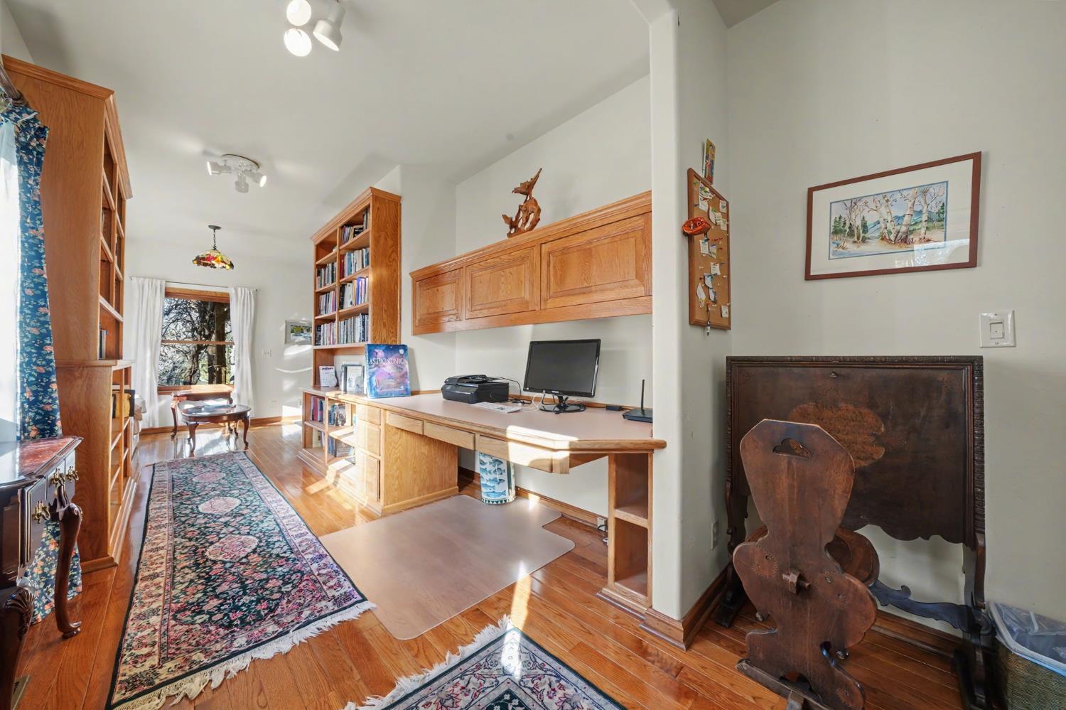 22707 Upton Road Plymouth, CA 95669 - Photo 57 of 99 a living room with furniture rug and a table