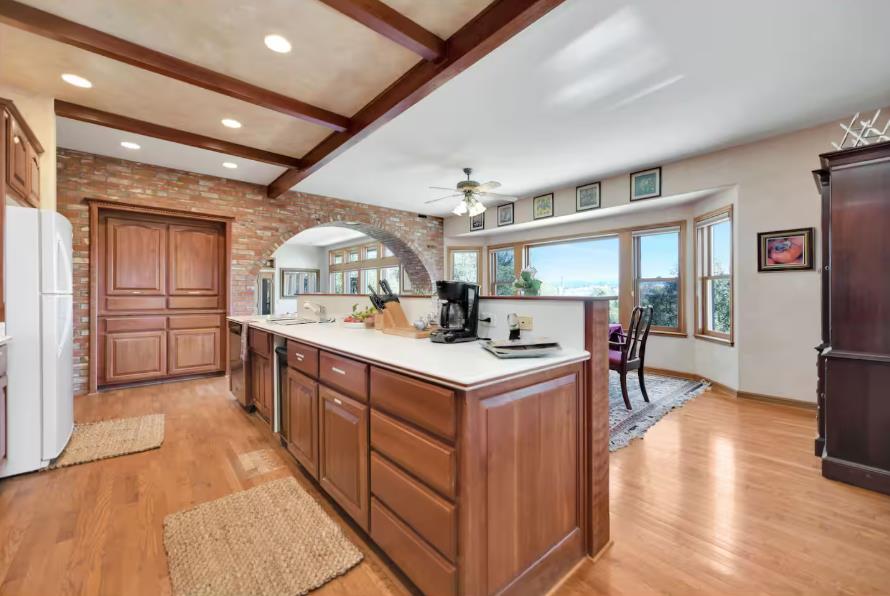 22707 Upton Road Plymouth, CA 95669 - Photo 7 of 26 a kitchen with stainless steel appliances granite countertop a large stove a sink dishwasher and cabinets with wooden floor
