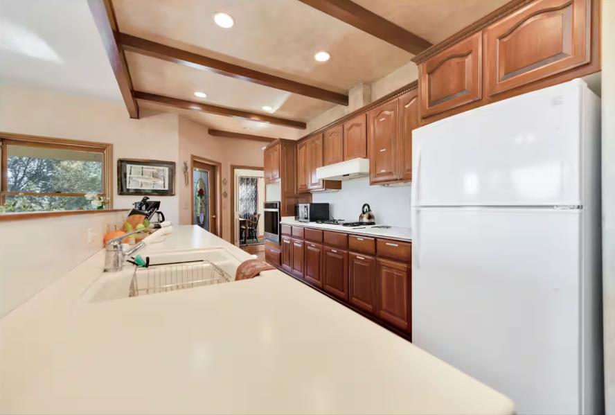 22707 Upton Road Plymouth, CA 95669 - Photo 8 of 26 a kitchen with sink a refrigerator and cabinets