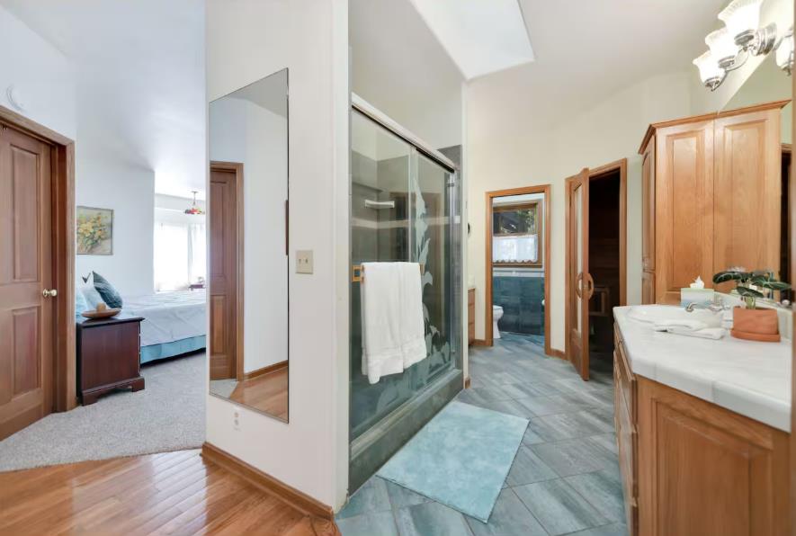 22707 Upton Road Plymouth, CA 95669 - Photo 9 of 26 a view of a hallway with bathroom and wooden floor