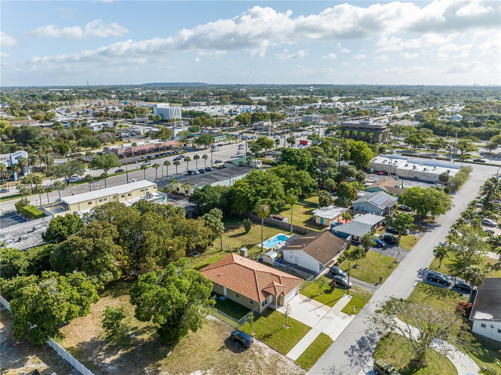 6109 Edwards Road Margate, FL 33063 - Photo 16 of 31 an aerial view of a city with lots of residential buildings