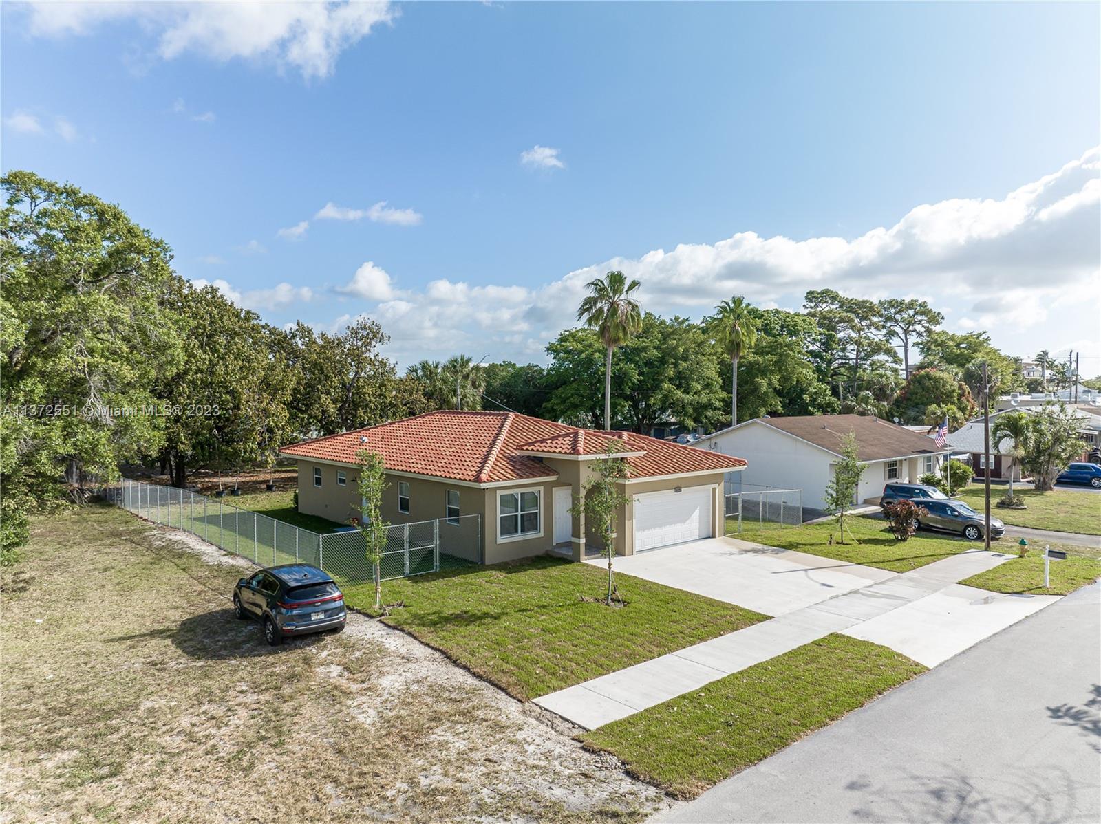 6109 Edwards Road Margate, FL 33063 - Photo 2 of 31 a view of a house with backyard and sitting area