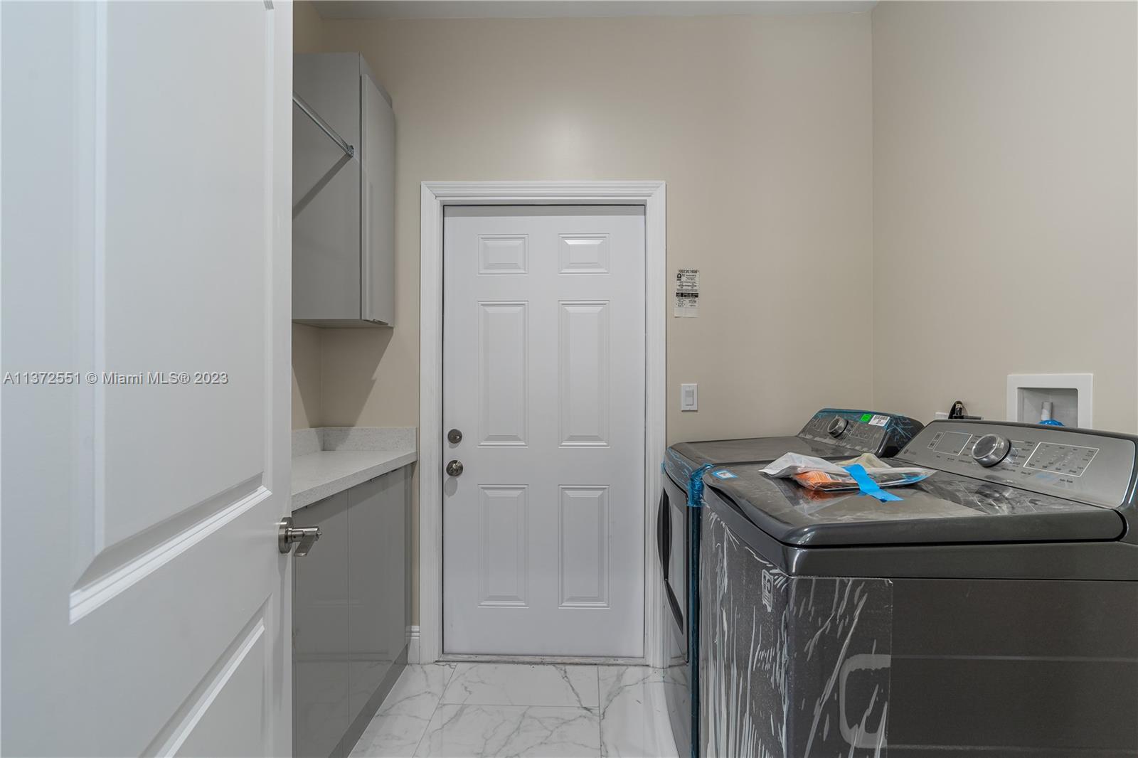 6109 Edwards Road Margate, FL 33063 - Photo 26 of 31 a utility room with washer and dryer