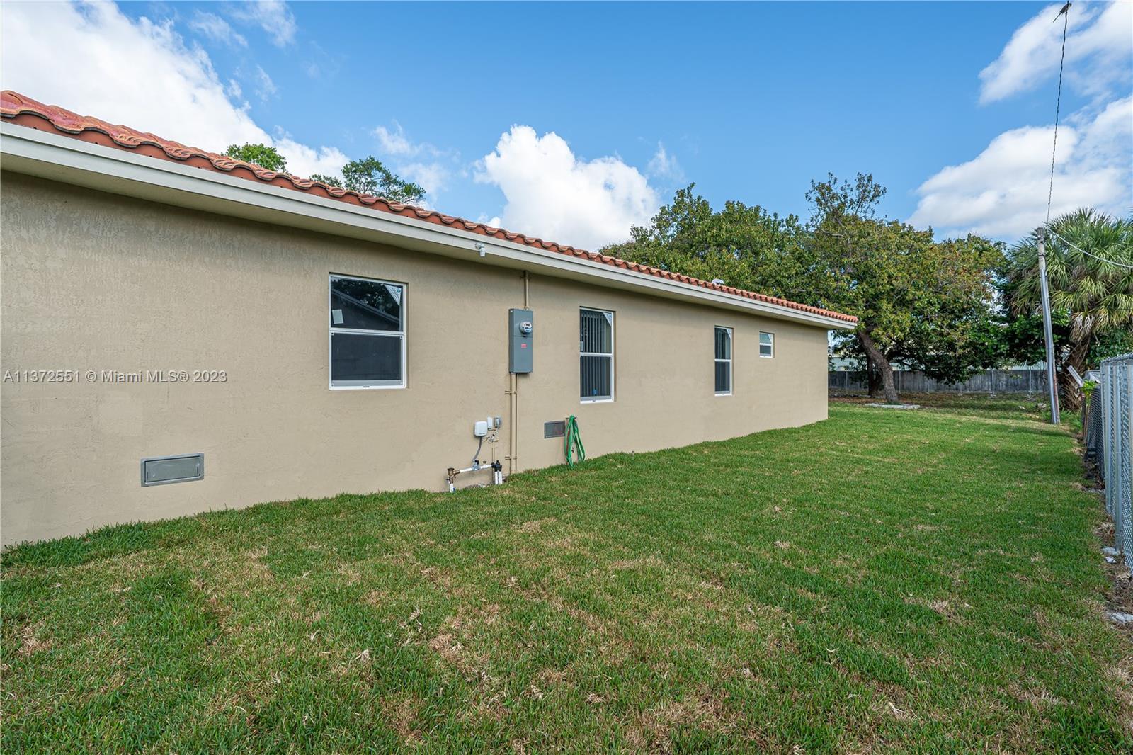 6109 Edwards Road Margate, FL 33063 - Photo 6 of 31 a backyard of a house with lots of green space