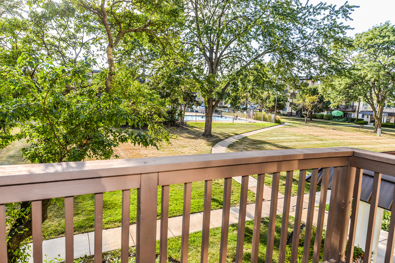 2226 South Goebbert Road, Unit 270 Arlington Heights, IL 60005 - Photo 12 of 27 a view of a balcony with trees