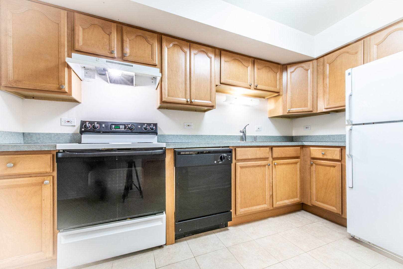 2226 South Goebbert Road, Unit 270 Arlington Heights, IL 60005 - Photo 2 of 27 a kitchen with granite countertop stainless steel appliances a stove and a refrigerator