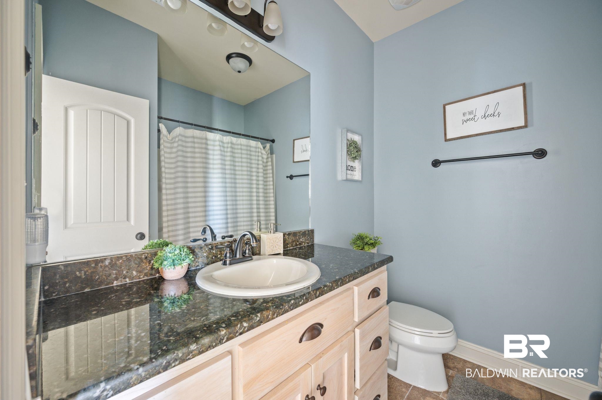 3879 Symphony Way West Semmes, AL 36575 - Photo 25 of 34 Bathroom featuring tile patterned flooring, vanity, and toilet
