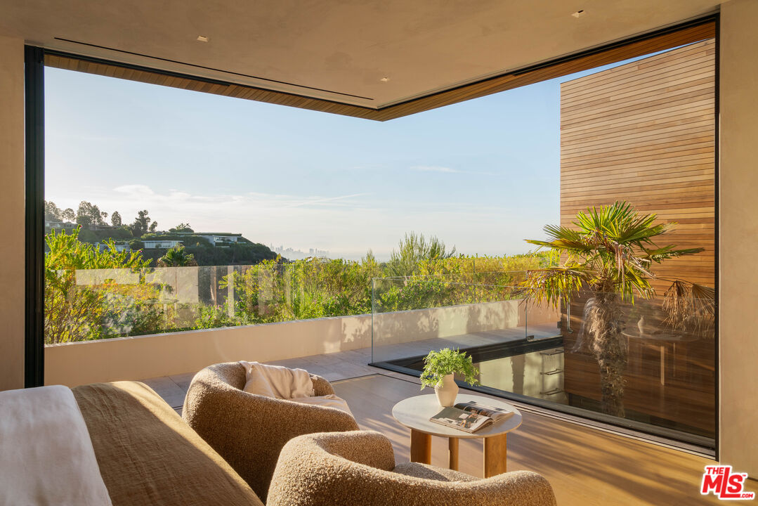 1520 Carla Ridge Beverly Hills, CA 90210 - Photo 13 of 24 a living room with furniture