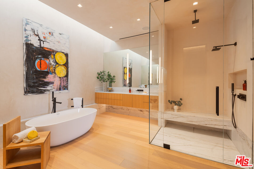 1520 Carla Ridge Beverly Hills, CA 90210 - Photo 14 of 24 a bathroom with a tub and a sink