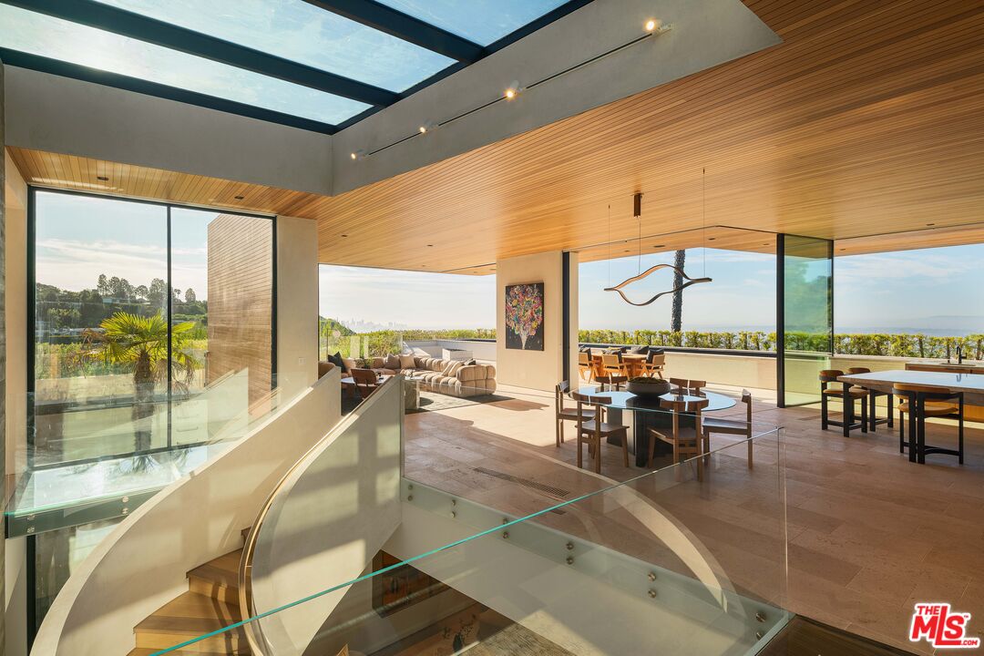 1520 Carla Ridge Beverly Hills, CA 90210 - Photo 5 of 24 a room with lots of tables and chairs