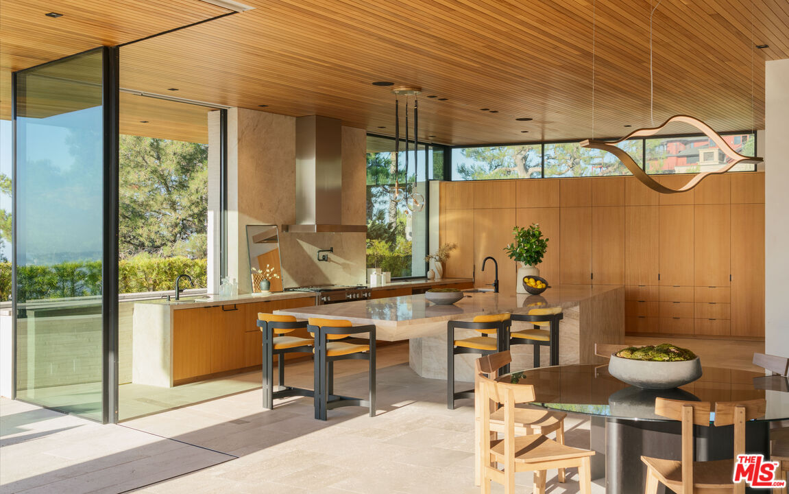 1520 Carla Ridge Beverly Hills, CA 90210 - Photo 8 of 24 a room with furniture and a window