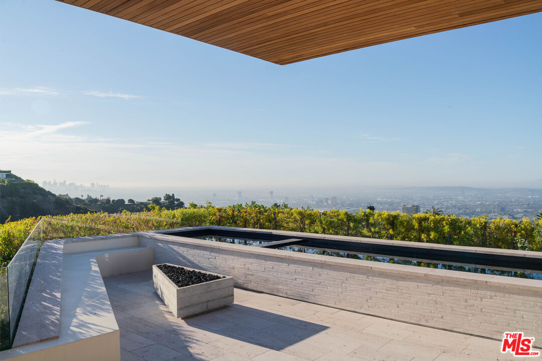 1520 Carla Ridge Beverly Hills, CA 90210 - Photo 10 of 24 a view of swimming pool with furniture and in background