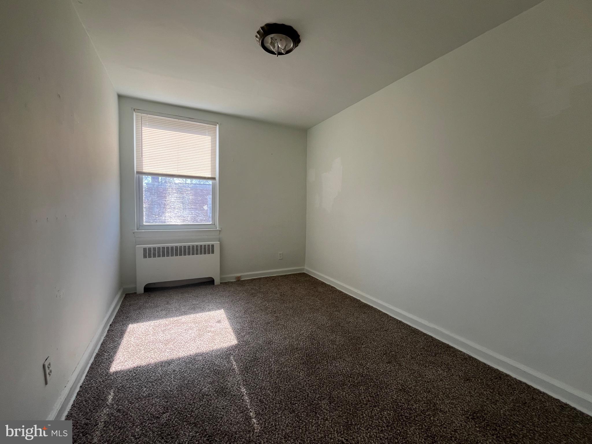914 East Sharpnack Street Philadelphia, PA 19150 - Photo 4 of 5 an empty room with a window