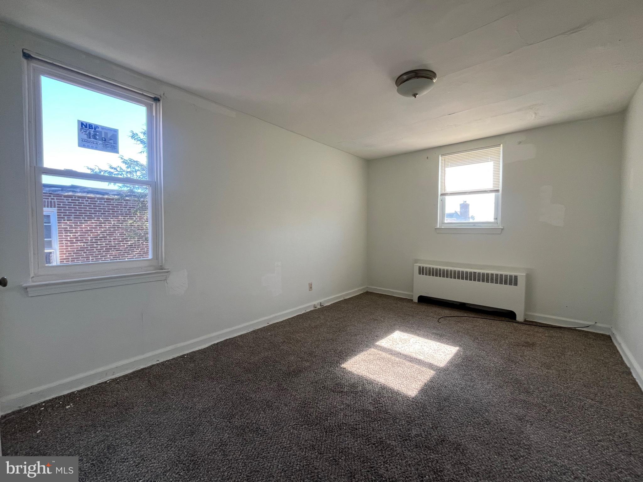 914 East Sharpnack Street Philadelphia, PA 19150 - Photo 5 of 5 an empty room with a window