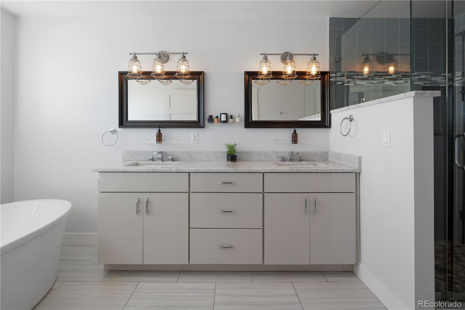 2436 Ames Street Edgewater, CO 80214 - Photo 17 of 34 a bathroom with a sink and a mirror