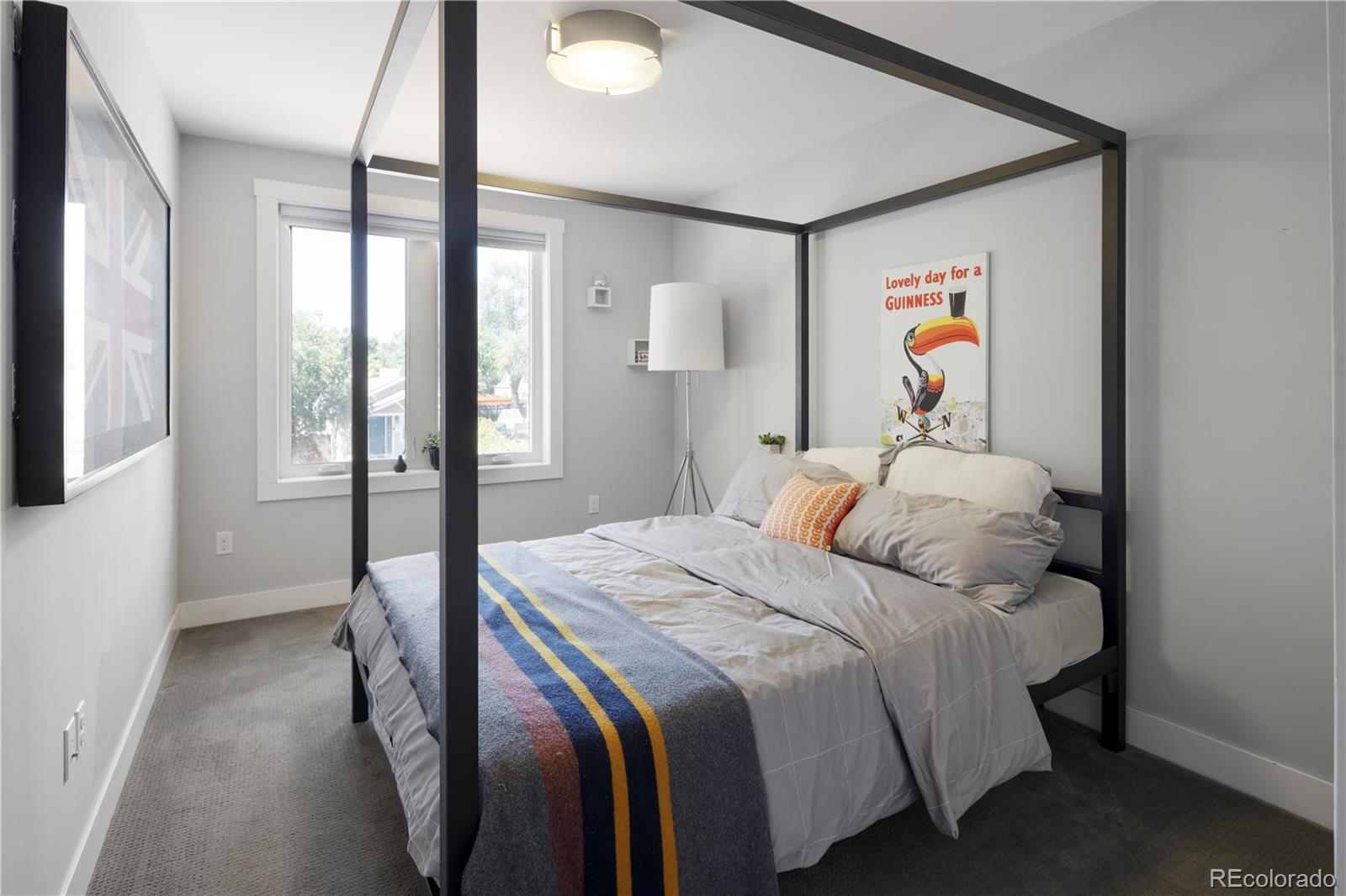 2436 Ames Street Edgewater, CO 80214 - Photo 20 of 34 a bedroom with a bed and a window