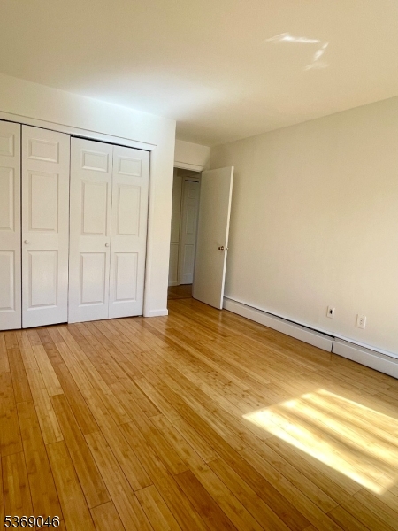 21 River Road, Unit G Nutley, NJ 07110 - Photo 3 of 22 a view of empty room with wooden floor