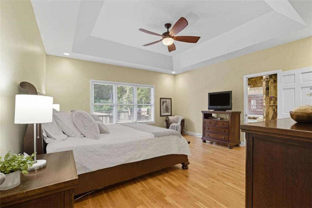 1091 Echota Road Clarkesville, GA 30523 - Photo 15 of 89 a bedroom with a bed and a flat screen tv