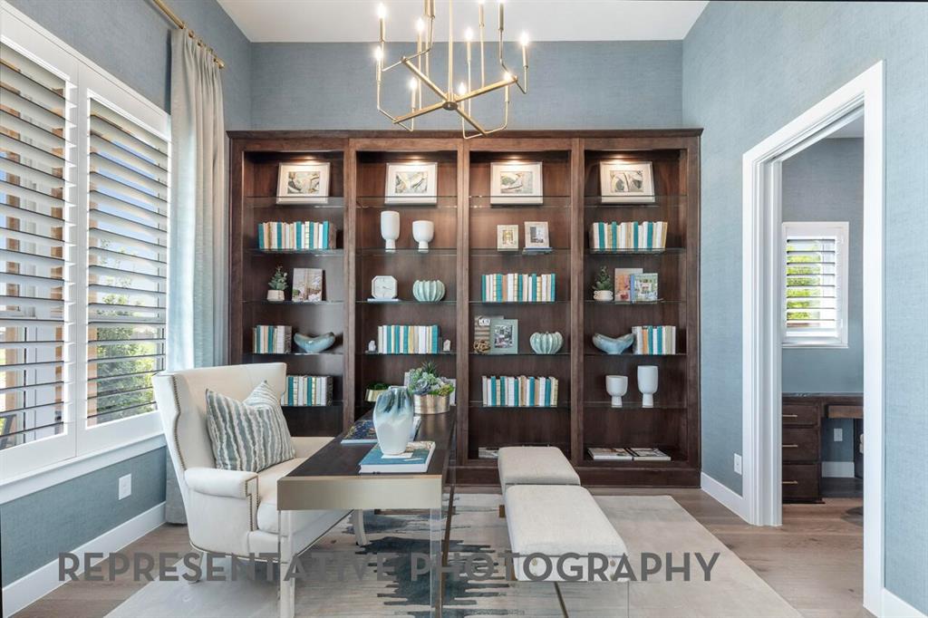 3908 Meander Way Prosper, TX 75078 - Photo 20 of 37 a work room with furniture and a book shelf