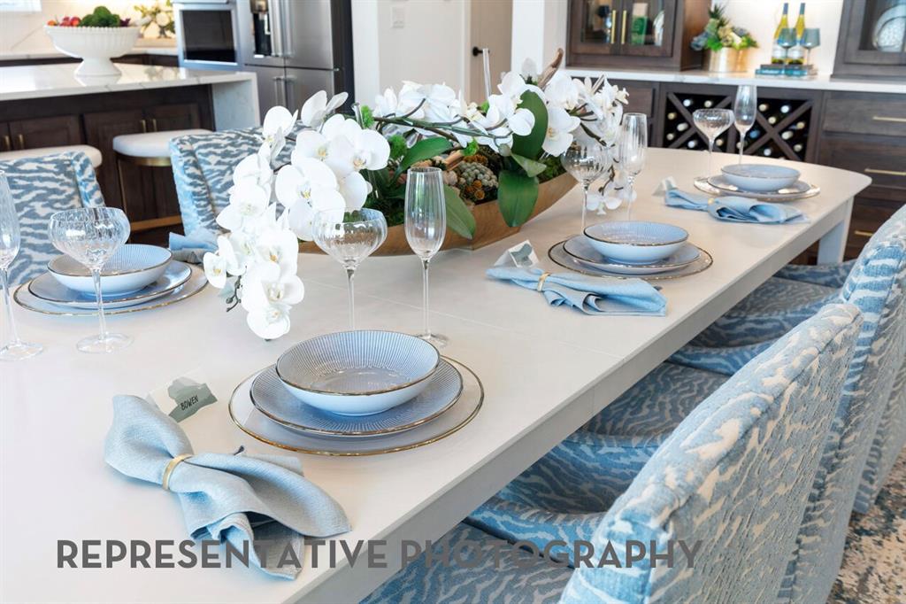 3908 Meander Way Prosper, TX 75078 - Photo 25 of 37 a dining room with furniture and a potted plant