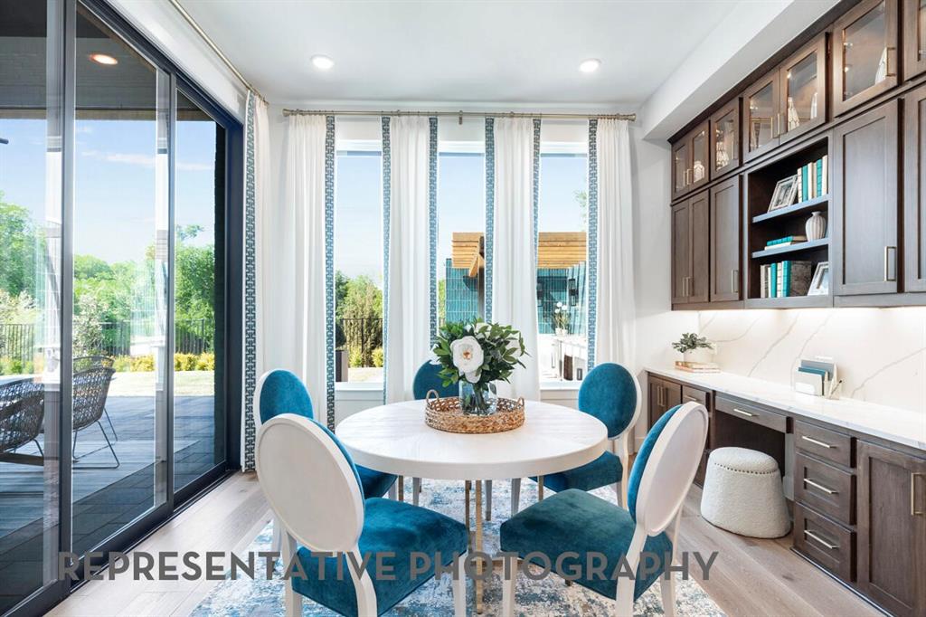 3908 Meander Way Prosper, TX 75078 - Photo 26 of 37 a view of a dining room with furniture window and wooden floor
