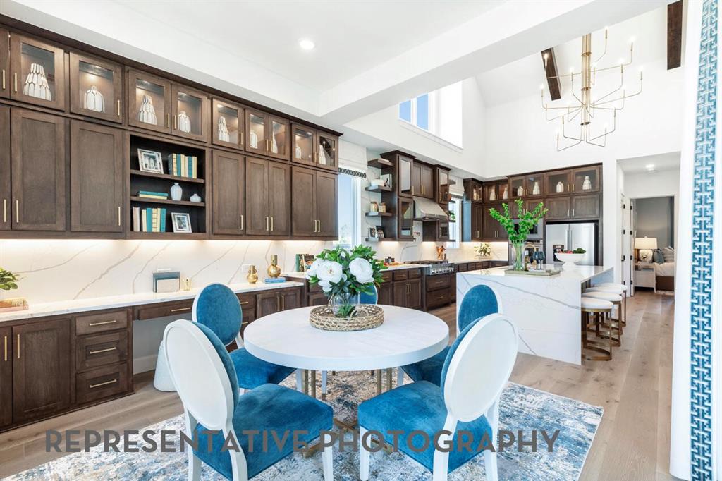 3908 Meander Way Prosper, TX 75078 - Photo 27 of 37 a view of a dining room with furniture