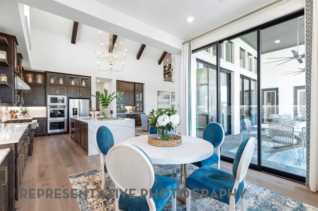 3908 Meander Way Prosper, TX 75078 - Photo 28 of 37 a view of a dining room with furniture window and wooden floor