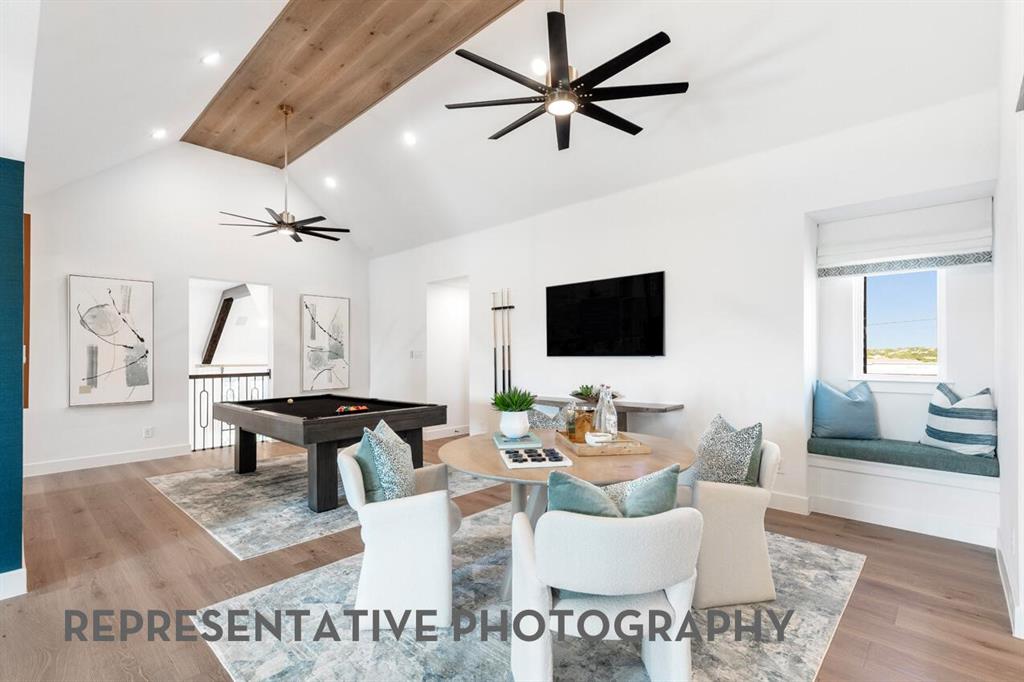 3908 Meander Way Prosper, TX 75078 - Photo 31 of 37 a living room with furniture and a flat screen tv
