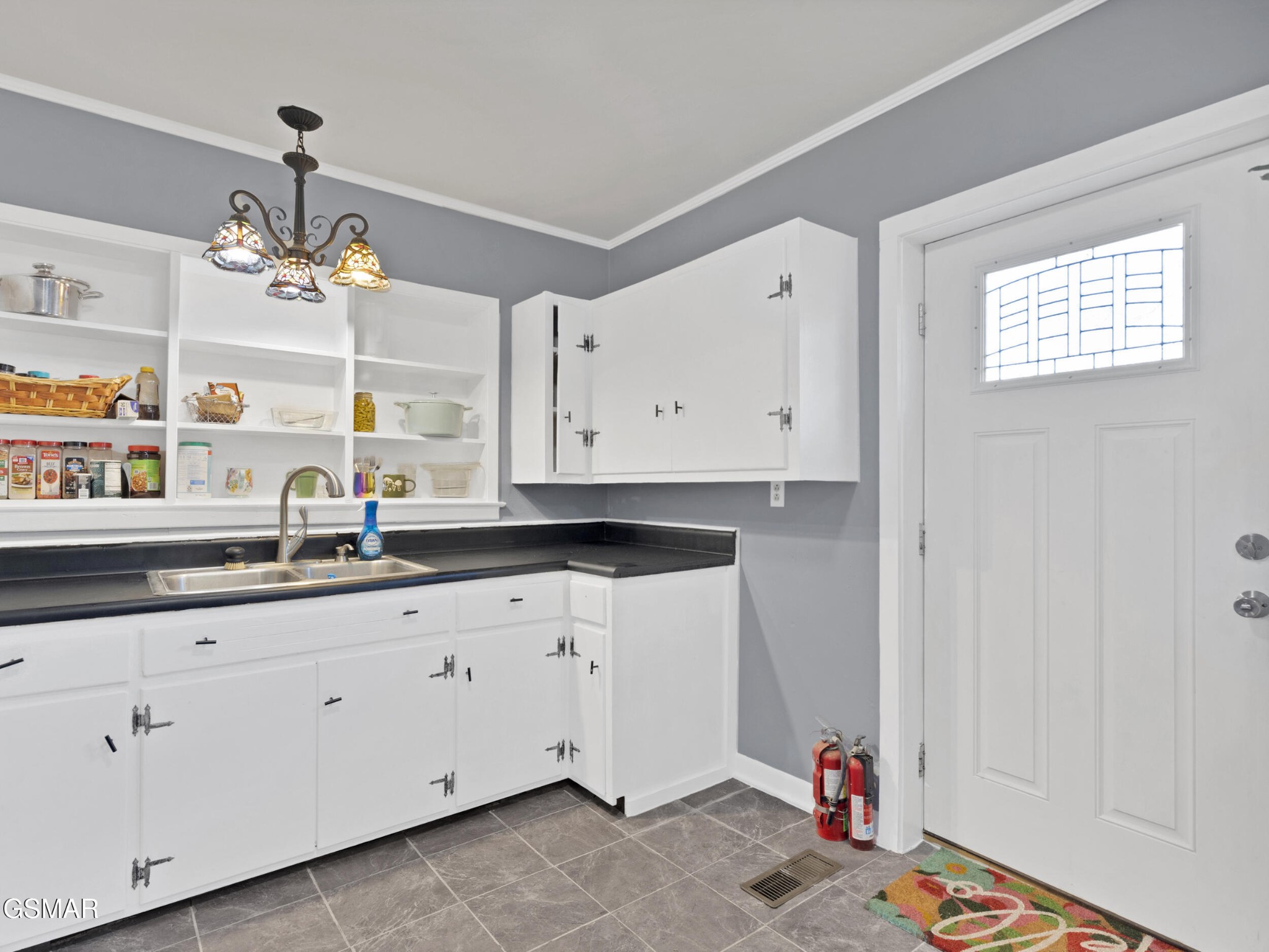 540 Carson Springs Road Newport, TN 37821 - Photo 20 of 32 a kitchen with granite countertop white cabinets and a sink