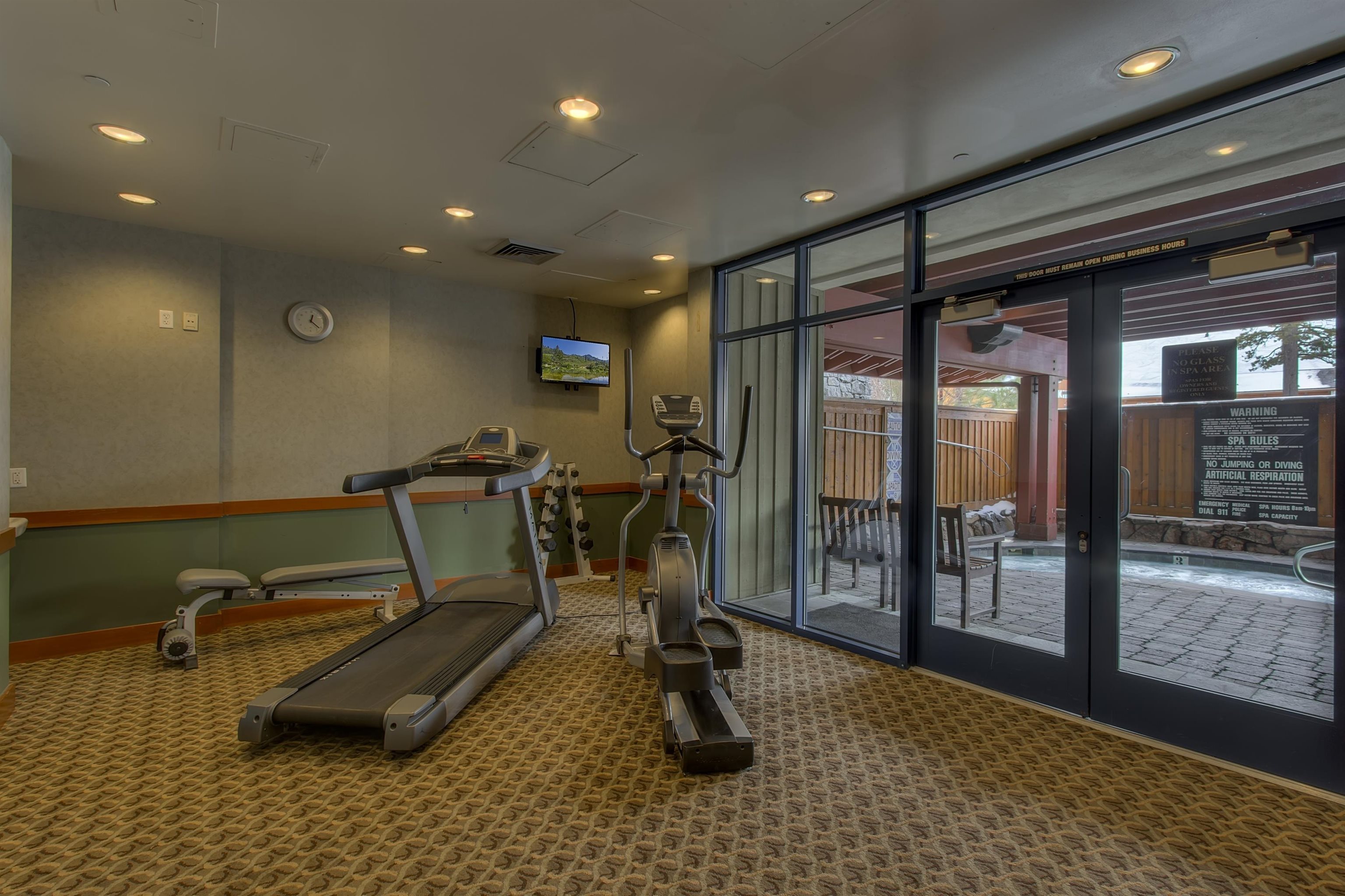 1850 Village South Road, Unit 4327 Olympic Valley, CA 96146 - Photo 18 of 25 a room with gym equipment and glass door