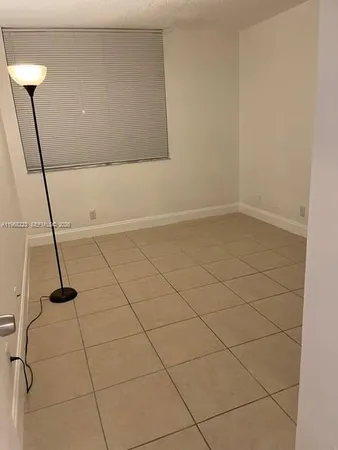 a bathroom with a granite countertop sink toilet a mirror and shower