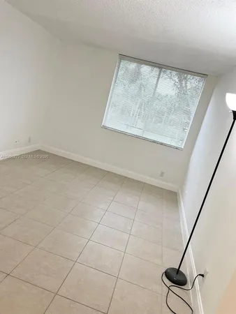 a view of an empty room with a fireplace