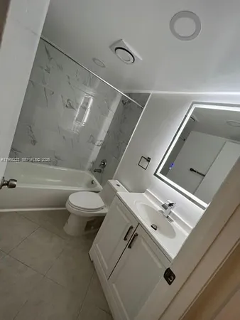 a bathroom with a sink a toilet and a bathtub