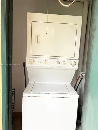a view of kitchen with stainless steel appliances cabinets and a counter top space