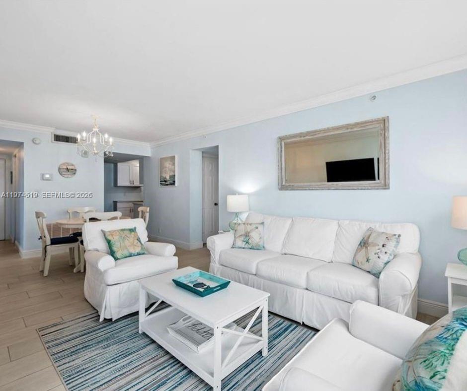 1505 North Riverside Drive, Unit 505 Pompano Beach, FL 33062 - Photo 3 of 9 a living room with furniture and a couch