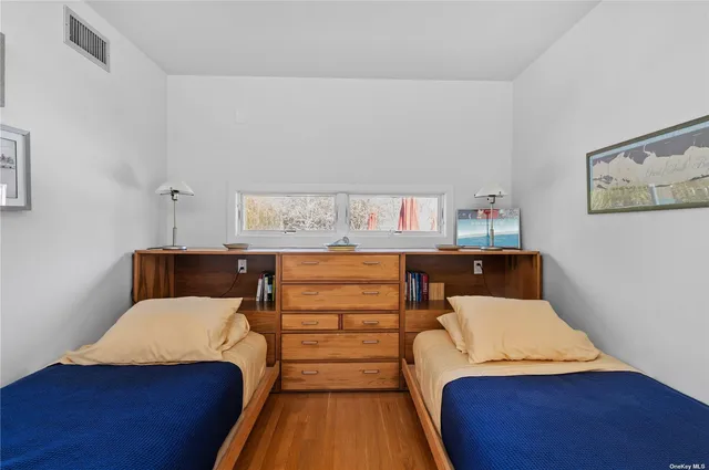 a bed room with a bed and a book shelf