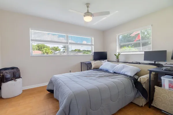 a bedroom with a bed and a desk