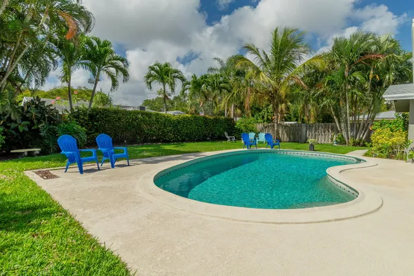 a view of swimming pool with a garden