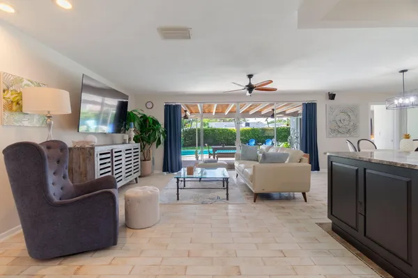 a living room with furniture and a large window