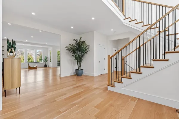 a view of an entryway with wooden floor