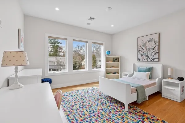 a bedroom with furniture and window