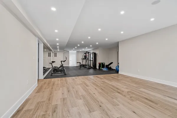 a view of a room with wooden floor