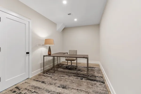 a view of a workspace with furniture