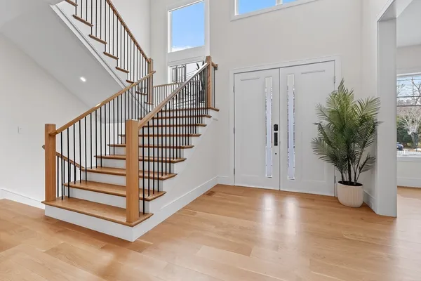 a view of entryway with wooden floor