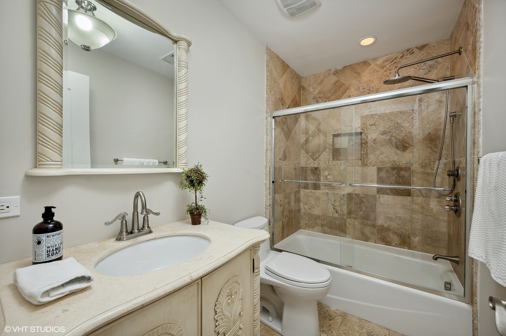 1640 Pfingsten Road Northbrook, IL 60062 - Photo 20 of 34 a bathroom with a sink toilet and shower