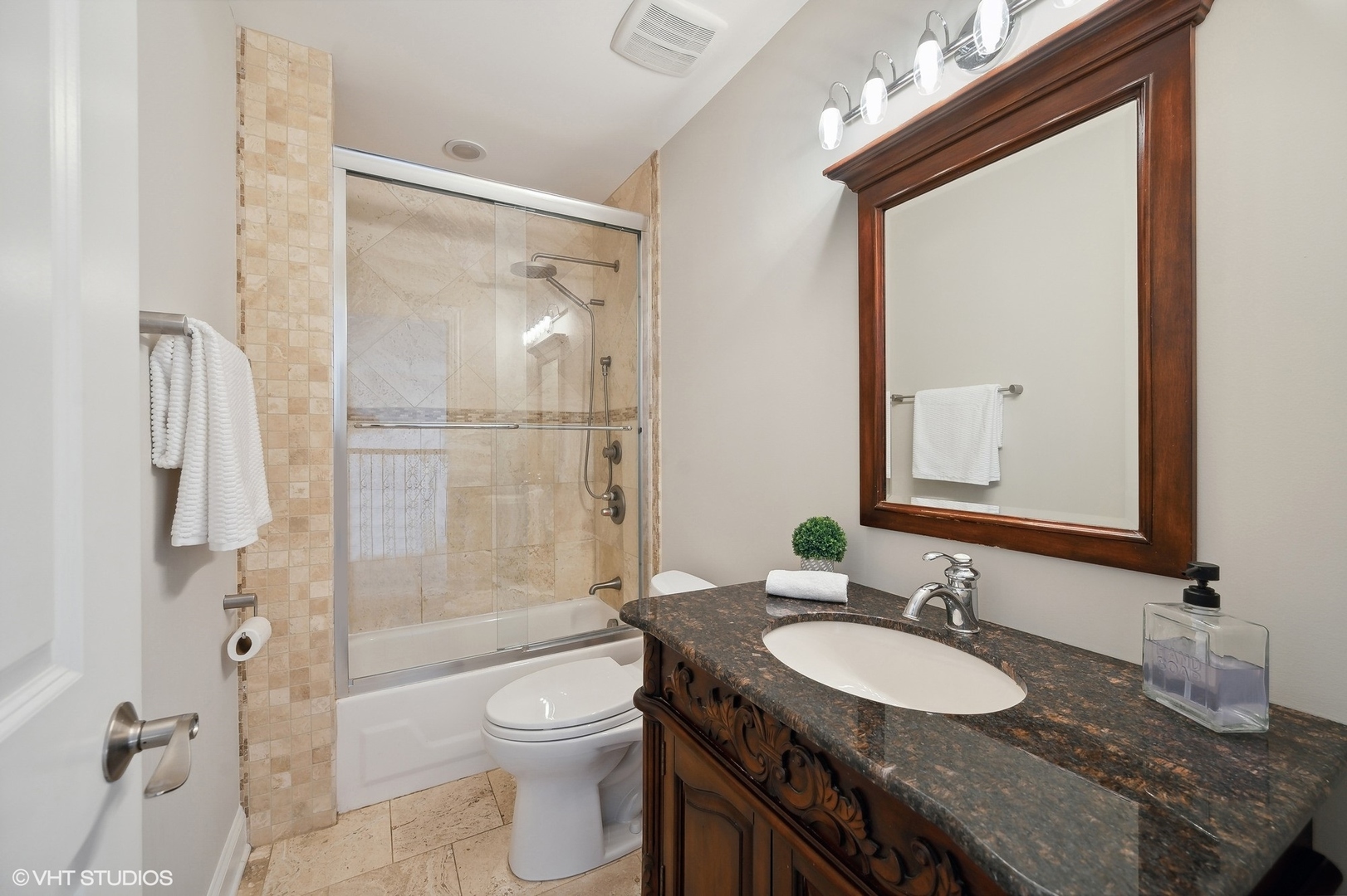 1640 Pfingsten Road Northbrook, IL 60062 - Photo 23 of 34 a bathroom with a granite countertop sink toilet and shower