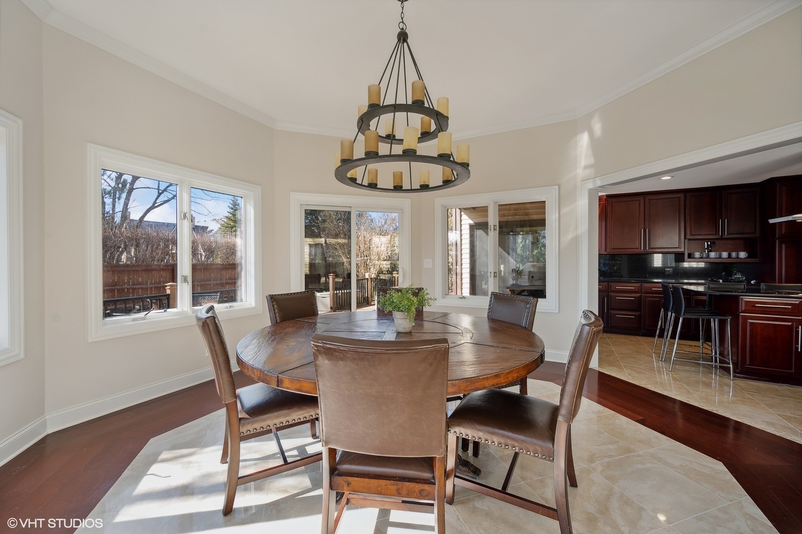 1640 Pfingsten Road Northbrook, IL 60062 - Photo 5 of 34 a dining room with furniture a chandelier and wooden floor